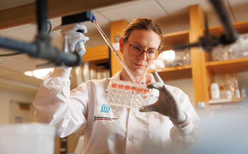 a woman working in a lab